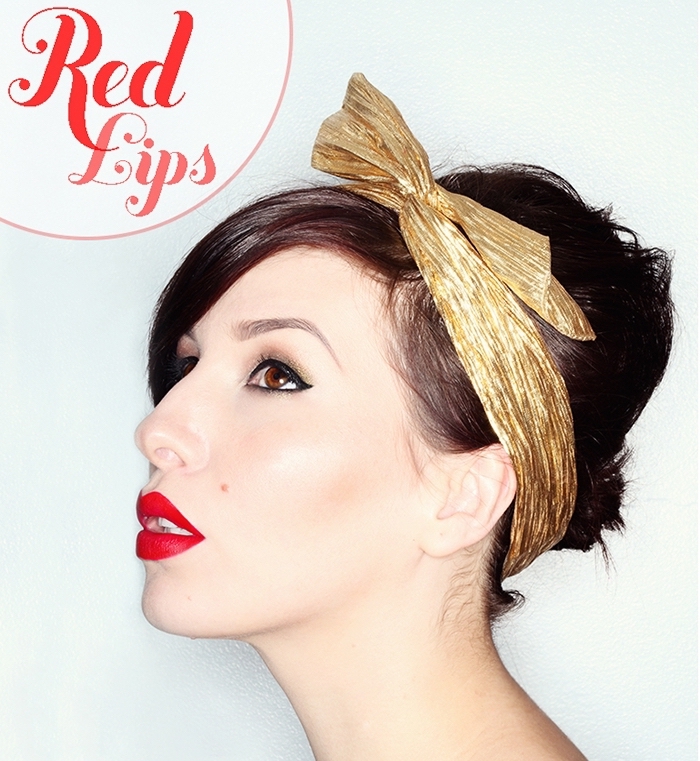 1950s-style headband in gold, worn by a brunette woman, with red lipstick, and black eyeliner, christmas eye makeup, festive party looks