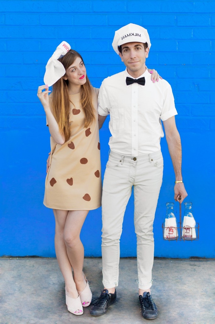 off-white trousers, and a white shirt with black bowtie, worn by a slim man, with a milkman's hat, holding some milk bottles, couple costume ideas,smiling woman,dressed as a cookie