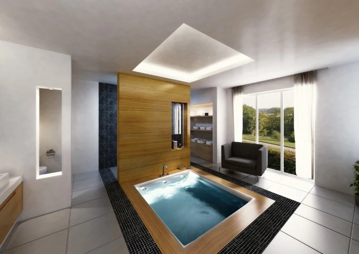 pool-like square bathtub, filled with water, and surrounded by wooden panels, bath remodel ideas, large space with tiled floor, and a dark grey sofa