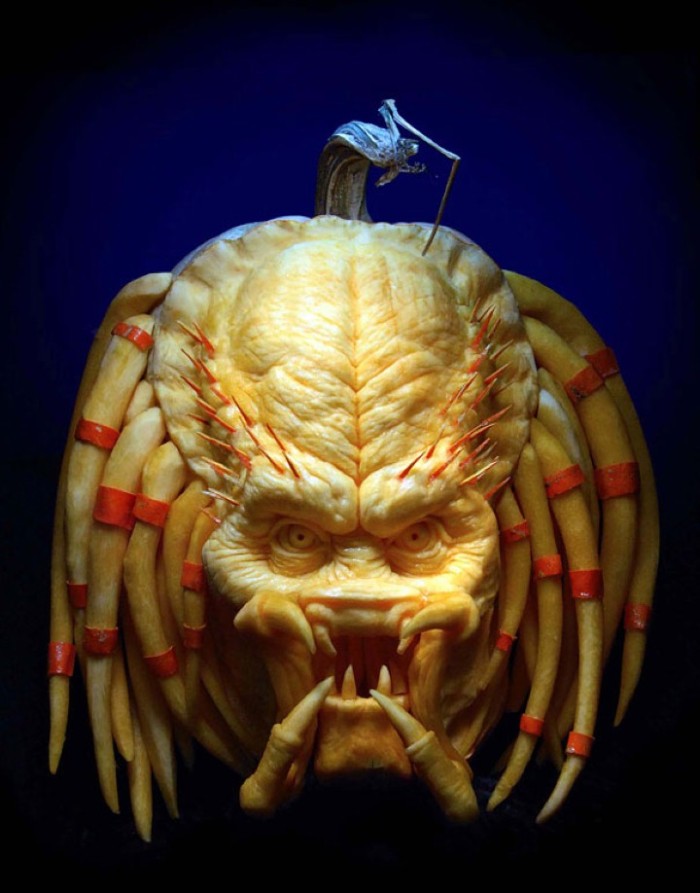 sculpture of the predator's head, made from a carved pumpkin, scary halloween decorations, very detailed and realistic art