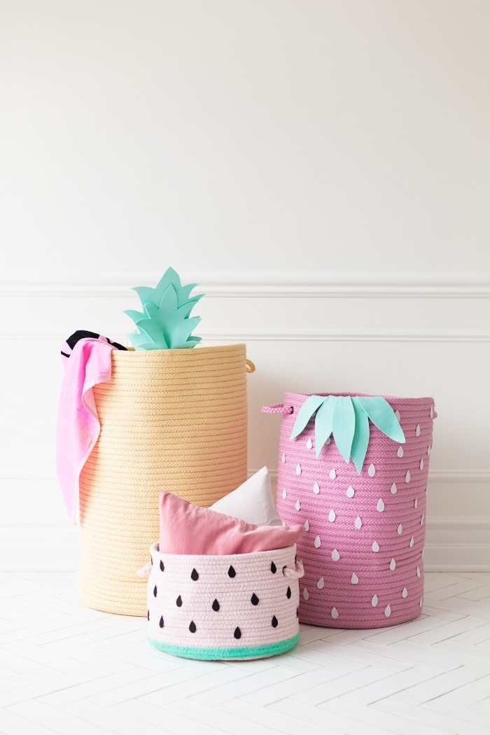 clothes baskets in three different shapes, decorated to look like fruit, how to decorate a bedroom, strawberry and pineapple, and a watermelon slice