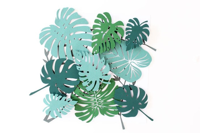 ready 3D paper collage, featuring different kinds of palm leaves, diy bedroom décor, on top of a square, white piece of paper