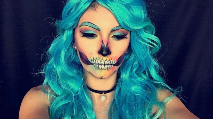 glam skull face paint, on a young woman, with long and wavy teal hair, and teal eyebrows, wearing matching teal eyeliner