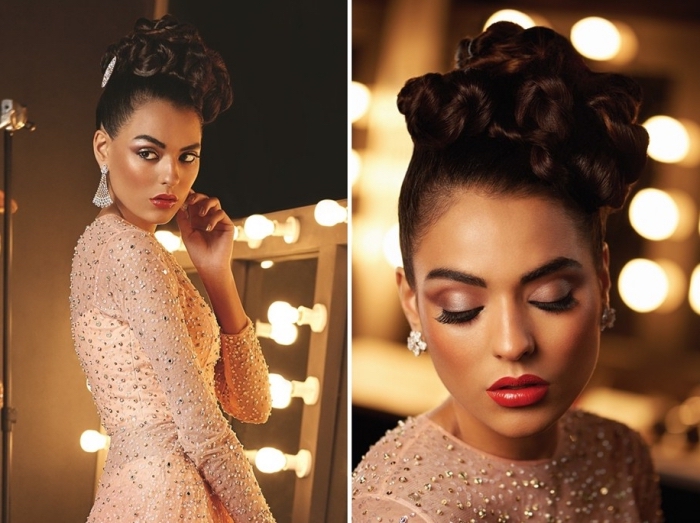 medium shot and close up, of a brunette woman, with dark curled hair, styled in an updo, christmas makeup looks, glossy red lips, and smokey pink eye shadow