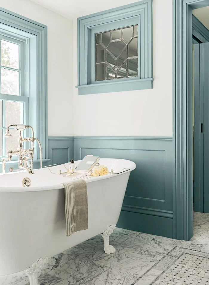 duck's egg blue wooden paneling, on the white walls of a bathroom, with a clawfoot bathtub, bathroom paint colors, smooth marble floor 