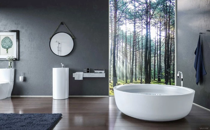 fluffy dark grey carpet, and grey walls, in a room with laminate floor, containing a round white bathtub, and a window with a woodland view, bathroom picture ideas, modern sink and a mirror