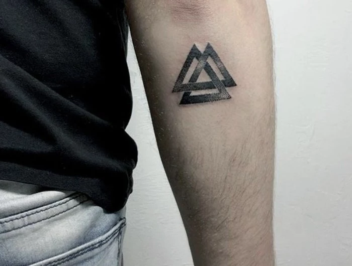 valknut tattoo in black, three intersecting triangles, a symbol of the nordic god thor, small meaningful tattoos