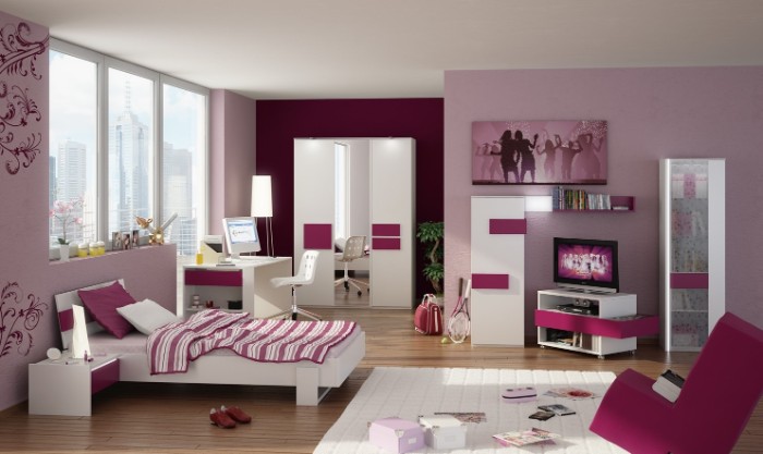 spacious room in pink, purple and white, with a large window, a bed and a wardrobe, cupboards and a tv