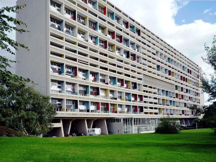 unité d'habitation built by le corbusier, large rectangular residential building, with balconies painted in different colors