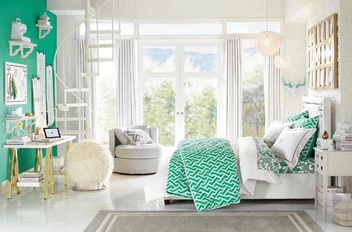 big room in white and green, with a large window, and white curtains, containing a large bed, a desk and a cream fluffy ottoman, cute teen rooms, pale grey rug