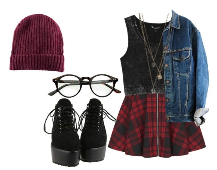 lace-up combat boots in black, with platform heels, a pair of glasses, ribbed burgundy beanie hat, tartan skirt with zipper front detail, dark grey cropped top, and a blue denim jacket