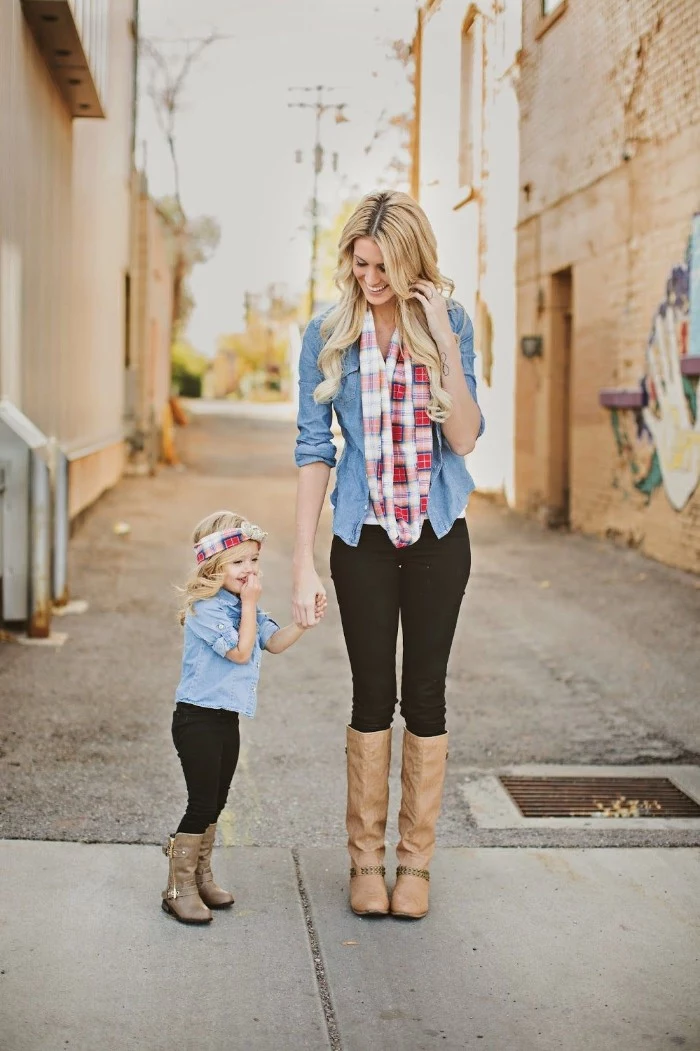 cute thanksgiving outfits, mother and small daughter, dressed in identical clothes, tall beige leather boots, black skinny jeans, light blue chambrays, and checkered scarves