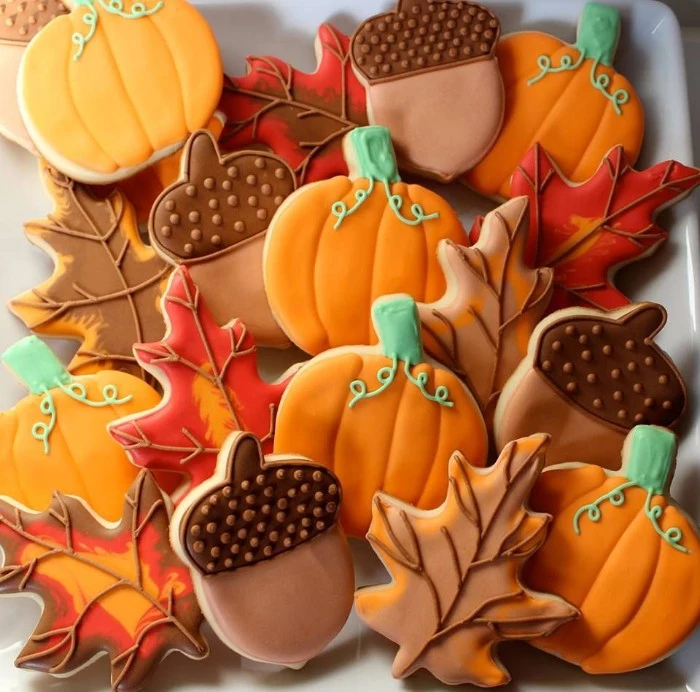 thanksgiving message to employees, cookies shaped like pumpkins, acorns and fall leaves, decorated with orange and beige, brown and green frosting