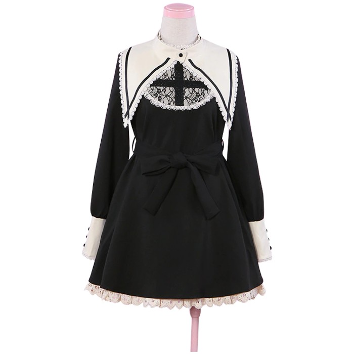 cross detail in black, on a black and white, lolita style dress, featuring a long white collar and cuffs, lace trims and a black belt