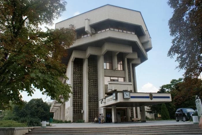 municipal building in ruse bulgaria, tall terraced concrete structure, with multiple reflective windows