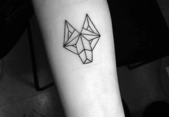 geometric line art of a wolf's head, tattooed in black ink, on a person's arm, minimalistic and creative design, cool arm tattoos