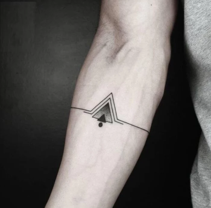 lines and triangles, in black and grey, and a single black dot, symmetrical cool arm tattoos, on the inside part of a man's arm, just below the elbow, best meaningful tattoo for men