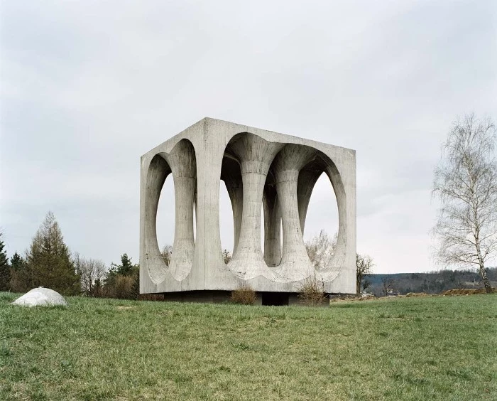brutalist art, a cube-shaped concrete monument, in ilirska bistrica former yugoslavia, in honor of the victims of ww II