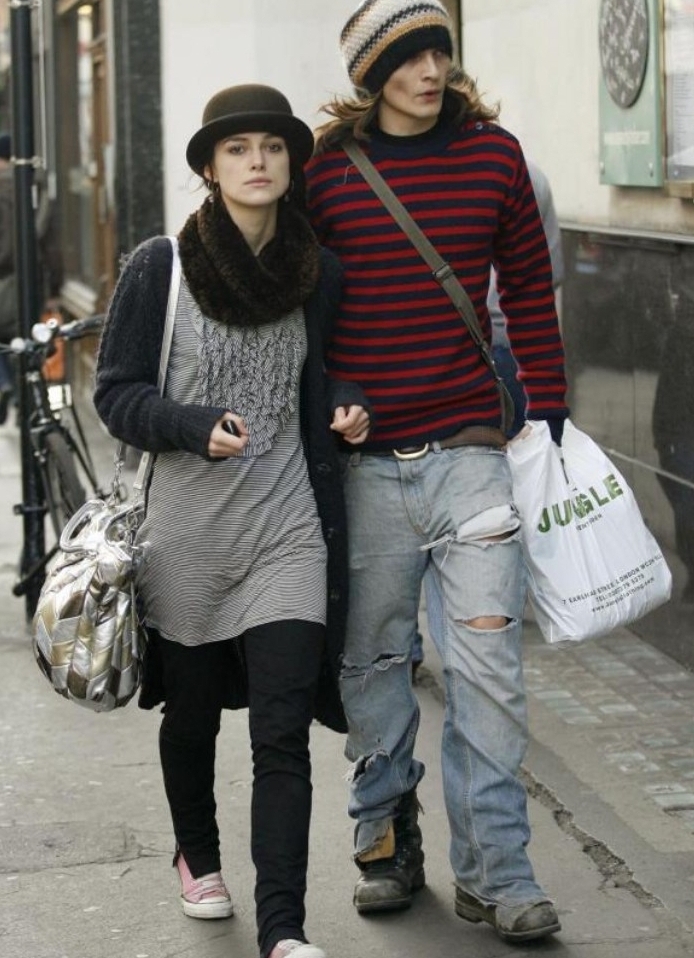 celebs wearing outfits, inspired by 90s and 80s grunge, keira knightley and her husband, walking side by side, in ripped jeans, and striped tops