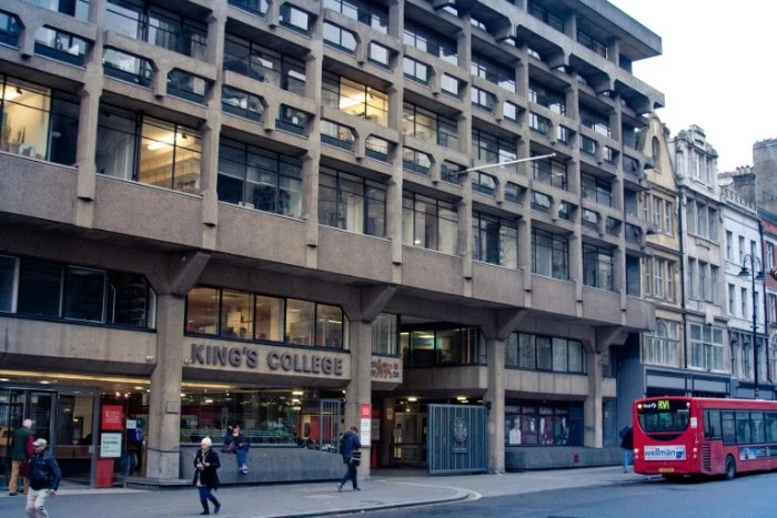 front view of king's college london's macadam building, dark beige brutalist structure, with multiple rectangular windows