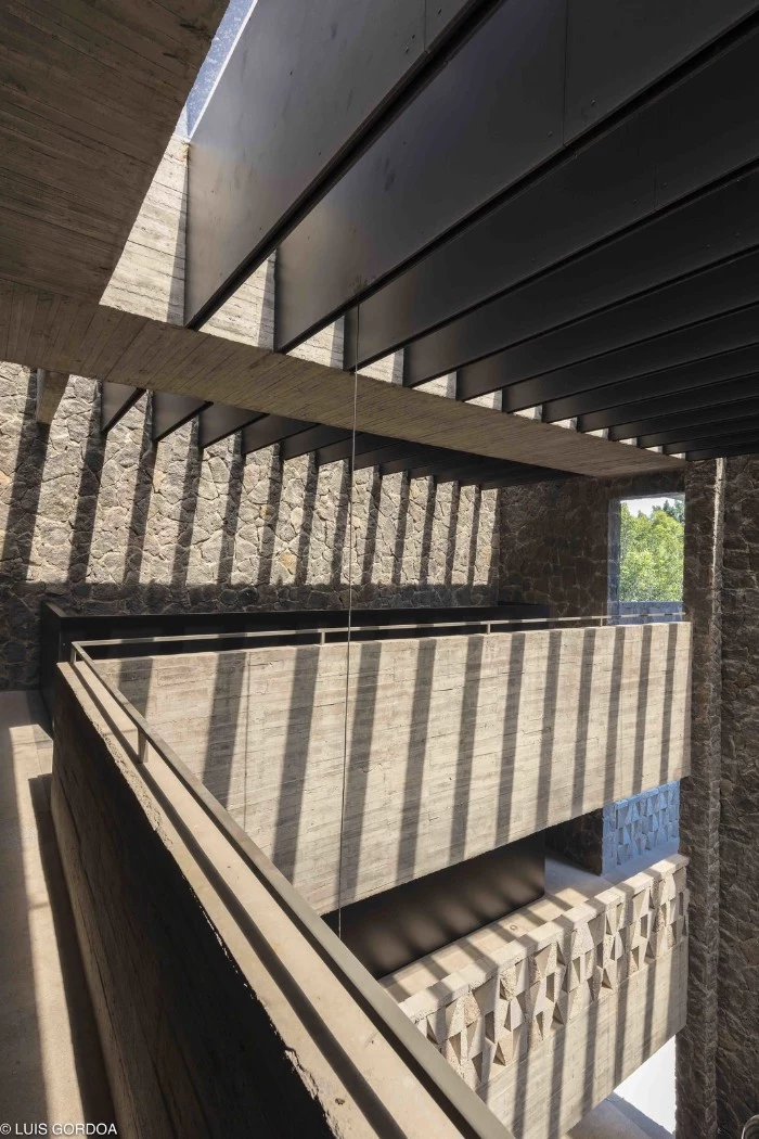 hotel in morelos mexico, featuring a ceiling, covered in multiple thin, dark grey segments, brutalist art and architecture 