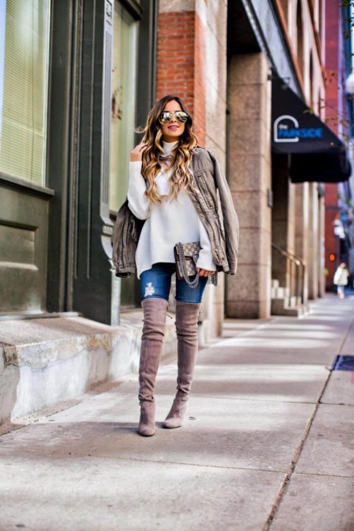 suede over-the-knee boots, in mink grey, worn with ripped skinny jeans, a baggy white polo neck jumper, and a creamy grey jacket