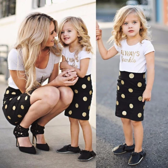 gold polka dots, on identical black skirts, worn by a mother and her small daughter, toddler thanksgiving outfit, similar white t-shirts, and different black shoes