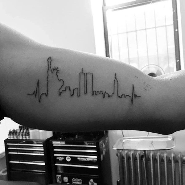 life line incorporating the new york city skape, as it was before 9/11, featuring the statue of liberty, the twin towers, and the empire state building, tattoos with deep meaning, on a man's arm