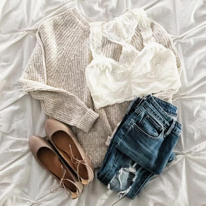chunky knit sweater in pale cream, white lace bralette, ripped blue jeans, and a pair of light beige ballet flats, bralette outfit suggestions