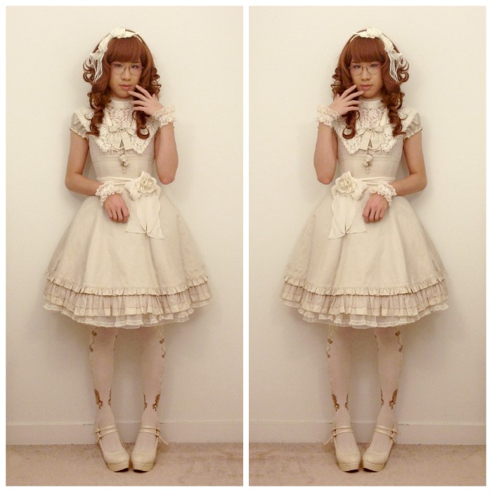 oatmeal colored lolita dress, with a cream lace bib detail, and a belt featuring a rose motif, worn over opaque, white and gold tights