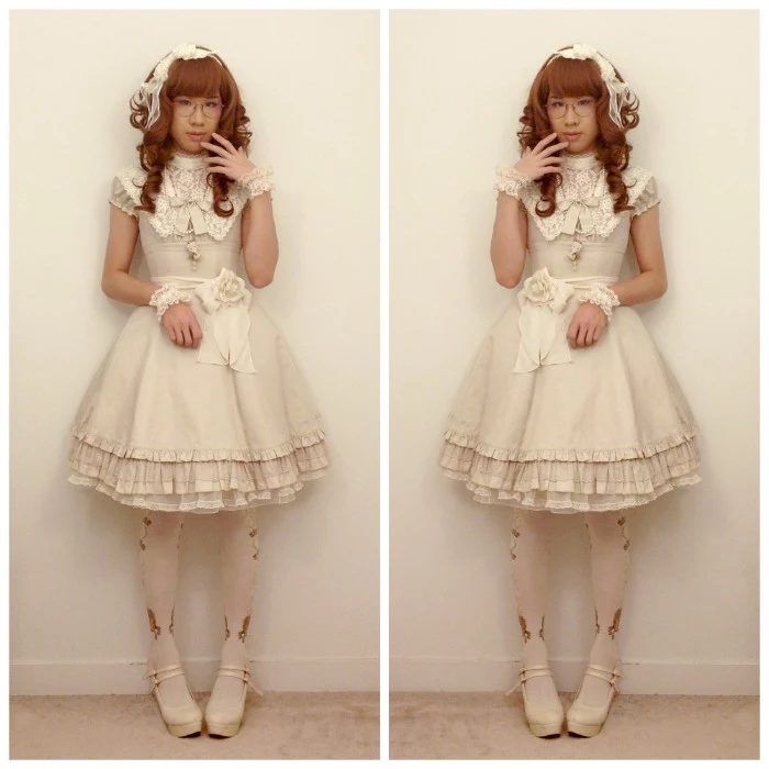 oatmeal colored lolita dress, with a cream lace bib detail, and a belt featuring a rose motif, worn over opaque, white and gold tights