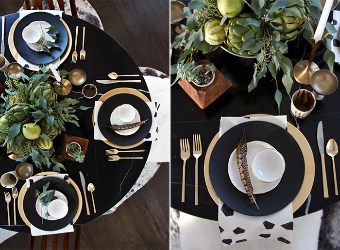 black round table, with gold and black and white dishes, and gold cutlery, thanksgiving dinnerware, green table centerpiece, featuring leaves and pears, gourds and artichokes