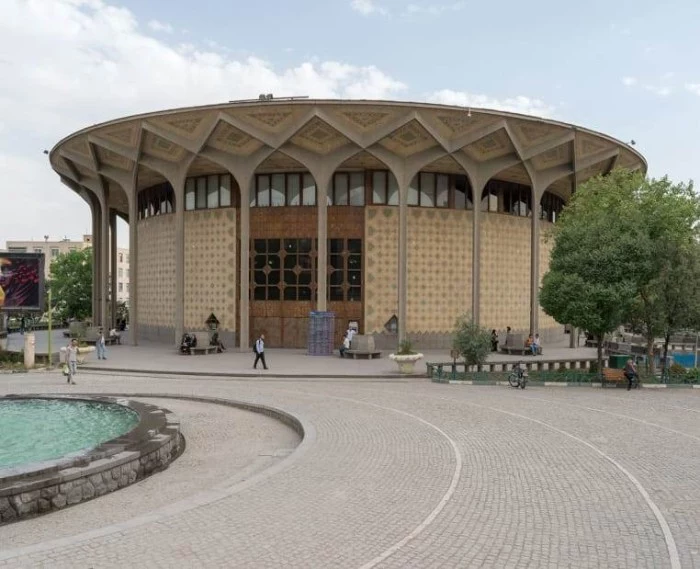 city theater of tehran, round building with an ornamental roof, supported by multiple concrete columns