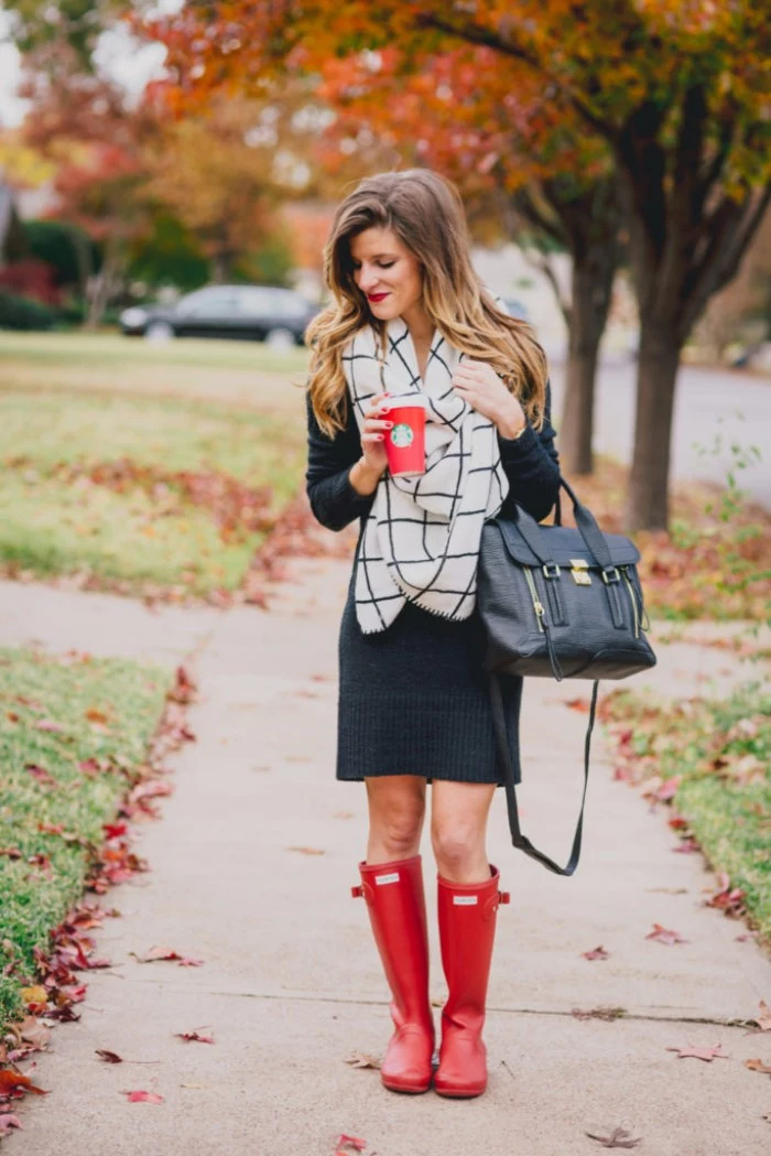 wellington boots in red, combined with a dark grey jumper dress, and a white and black, checkered blanket scarf, comfy outfits, black leather bag