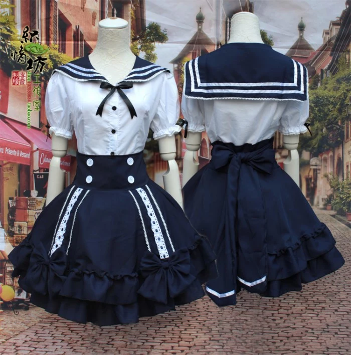 front and back view of a dress, in white and navy, resembling a sailor's uniform, lolita fashion, white lace incerts, ribbons and bows