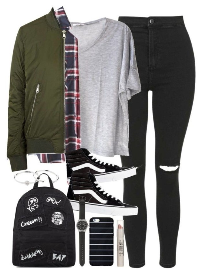 backpack in black, decorated with white scribbles, khaki green jacket, plaid shirt and a baggy, pale grey t-shirt, ripped black skinny jeans, black and white sneakers