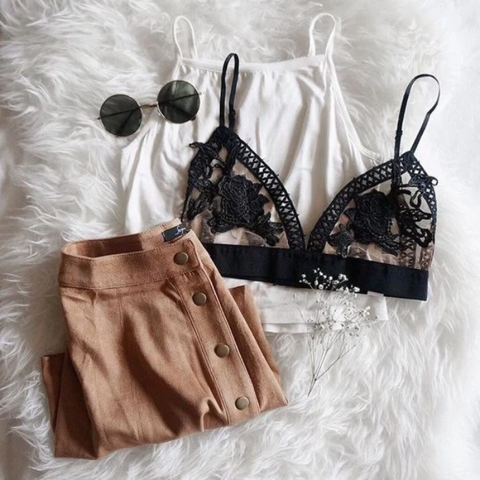beige button-up skirt, white tank top, black embroidered see through bralette, and a pair of round sunglasses