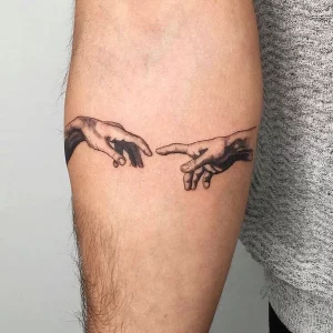 small tattoos for men the creation tattoo