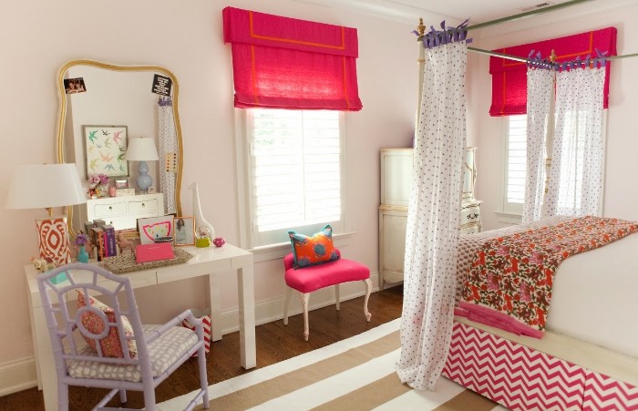 lavender colored chair, near a white desk, with a mirror in a gold frame, cute teen rooms, bed with white curtains, brown and white striped rug