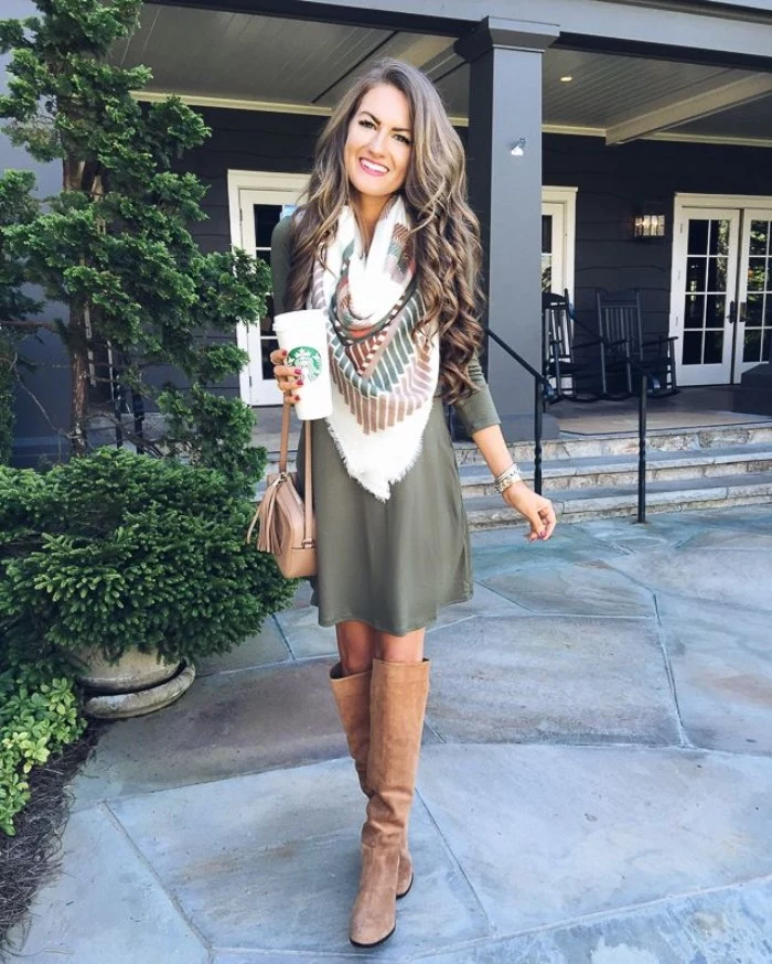 blanket scarf in white, with dark green and brown motifs, worn over a greyish-green jumper dress, comfy outfits, paired up with beige, suede over-the-knee boots