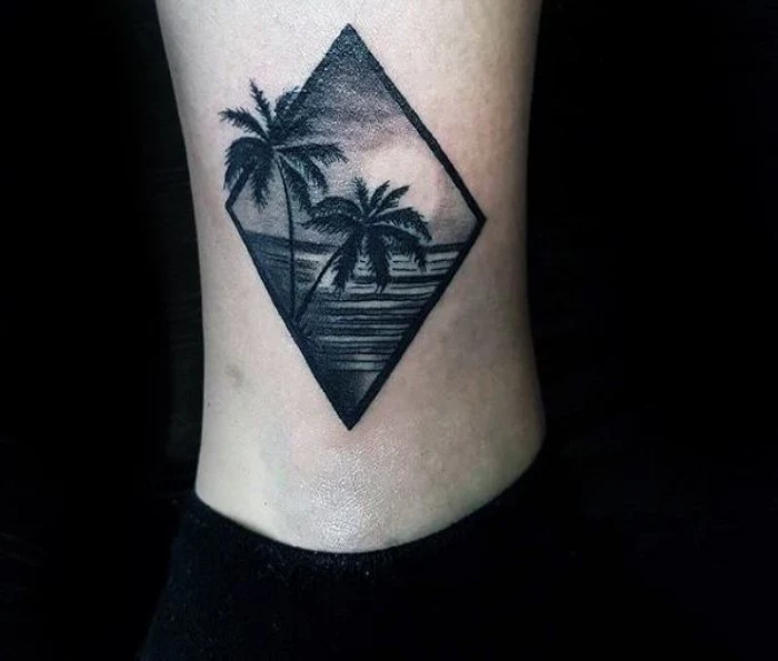 couple of palm trees, and a sunset over a sea, tattooed in a diamond shape, small tattoos for men, on a guy's ankle