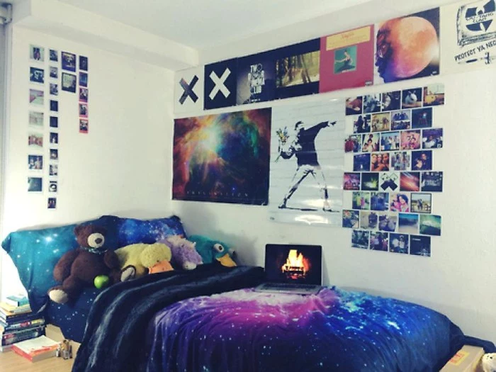 white walls decorated with multiple polaroid photos, posters and other images, teenage bedroom ideas for small rooms, near a single bed, featuring duvet and pillow covers, with outer space motifs