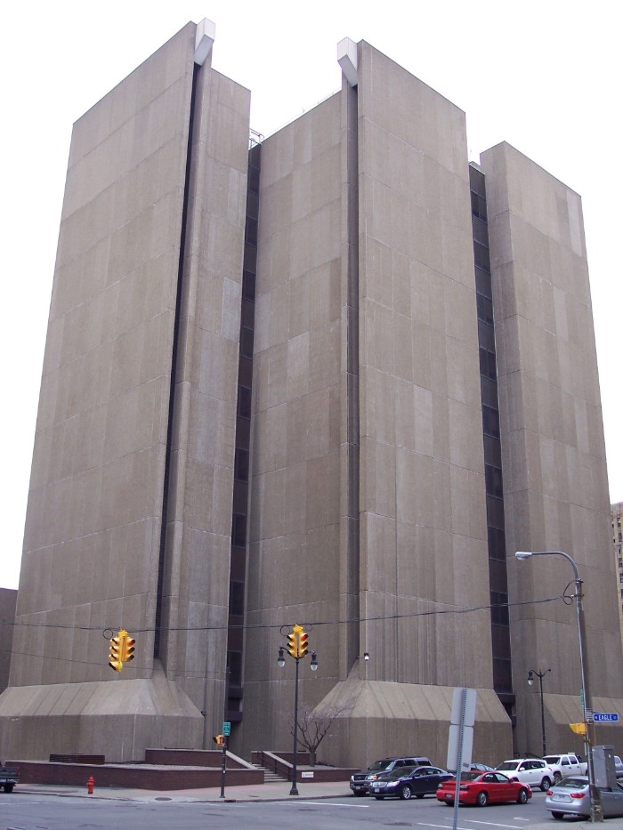 buffalo city court building, in buffalo new york, three tower like structures, made of smooth concrete blocks, with tall narrow windows