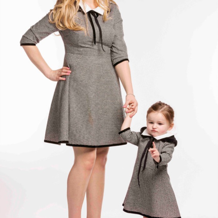 identical dresses made from tweed, with quarter sleeves, and white collars, featuring black ribbons, cute thanksgiving outfits, worn by a mother and daughter