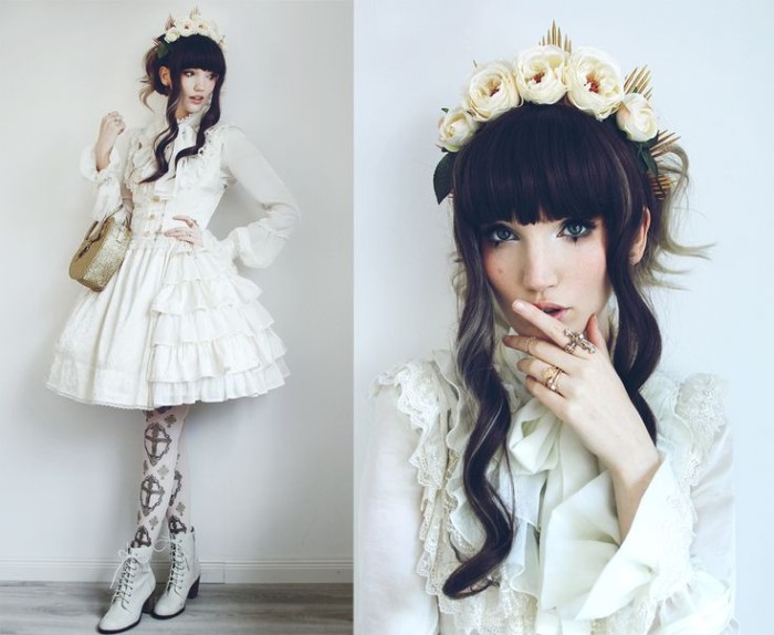 fake roses in cream, decorating the black hair of a japanese lolita, dressed in a white tiered dress, with lace and frills
