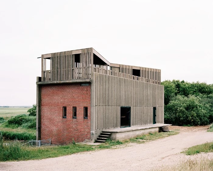 johansen skovsted design, brutalist art, of a skjern river pump station, made from brick and concrete, with a rooftop terrace