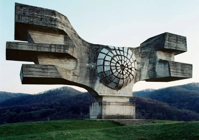podgaric monument made of concrete, comemorating the victims of ww II, asymmetric brutalist design resembling wings