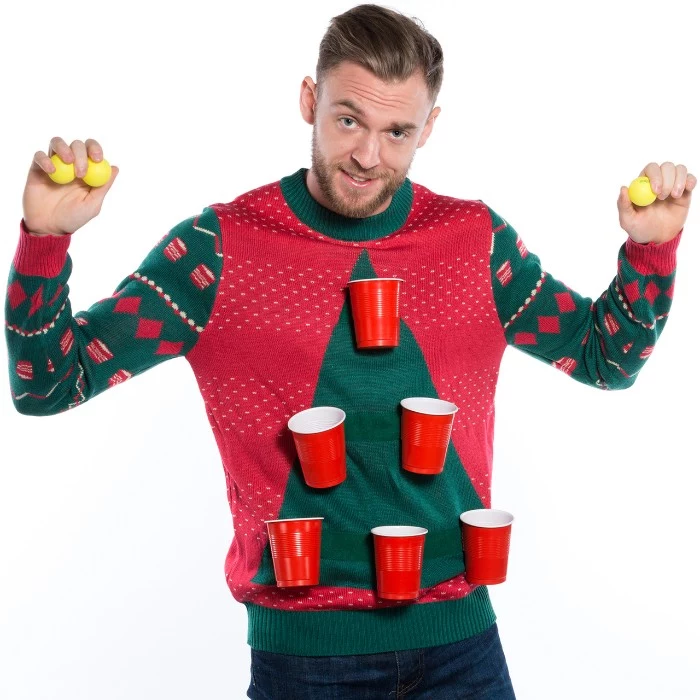 six red plastic cups, stuck on a red jumper, with a large green triangle, resembling a christmas tree, ugly sweater ideas, worn by a man, holding several yellow beer pong balls