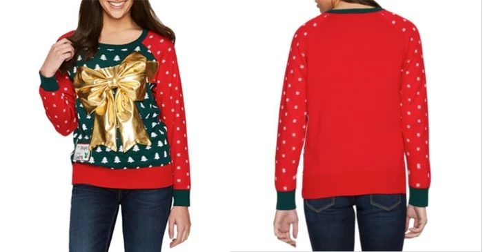 tacky jumper in dark green and red, with tiny white snowflakes and christmas trees pattern, and a large metallic gold bow, girls ugly christmas sweater