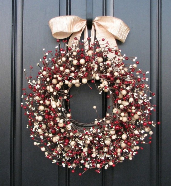 thin branches twisted together, to form a wreath, with lots of white, and red berries, in different sizes, diy wreath suggesions, pale gold bow on top